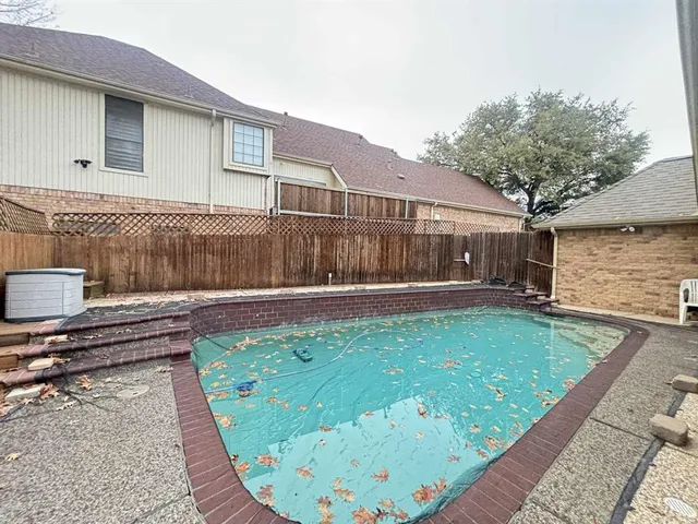 a view of a backyard with a sitting area