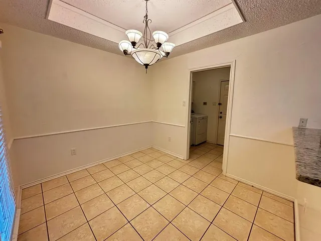 a view of a livingroom with chandelier
