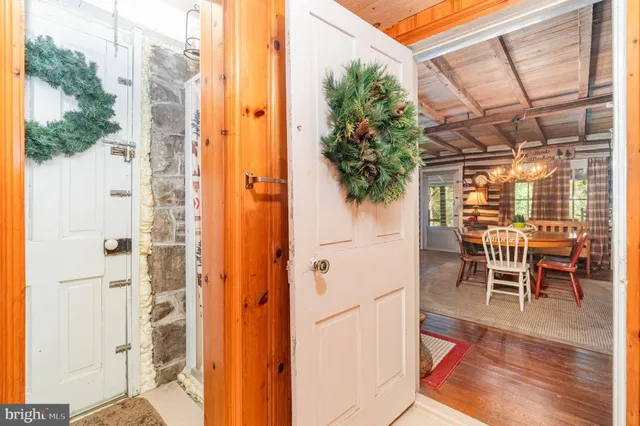 a dining room with furniture and a window