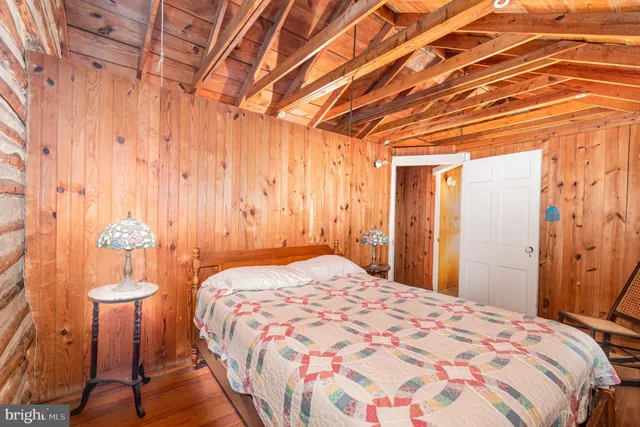 a bedroom with a bed and a shower