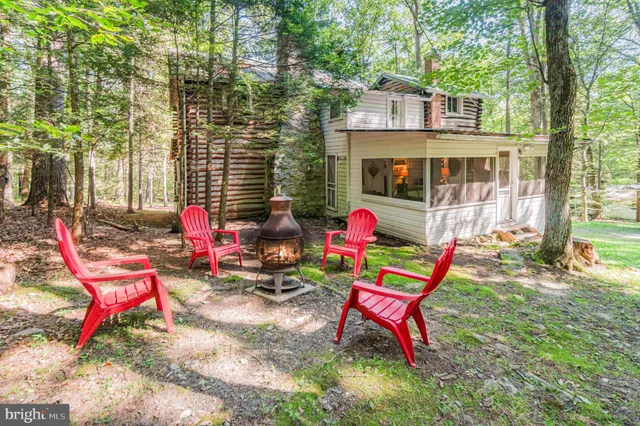 a backyard of a house with outdoor seating