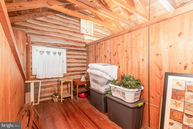 a view of balcony with furniture and potted plants