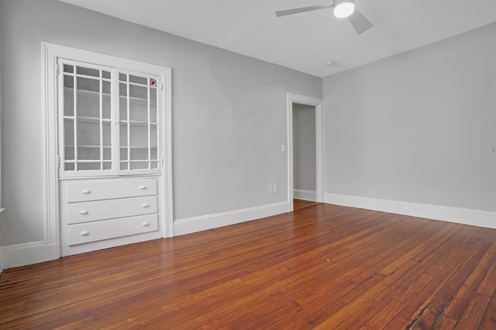 116 Winthrop Road, Unit 3 Brookline, MA 02445 - Photo 9 of 21 wooden floor in an empty room