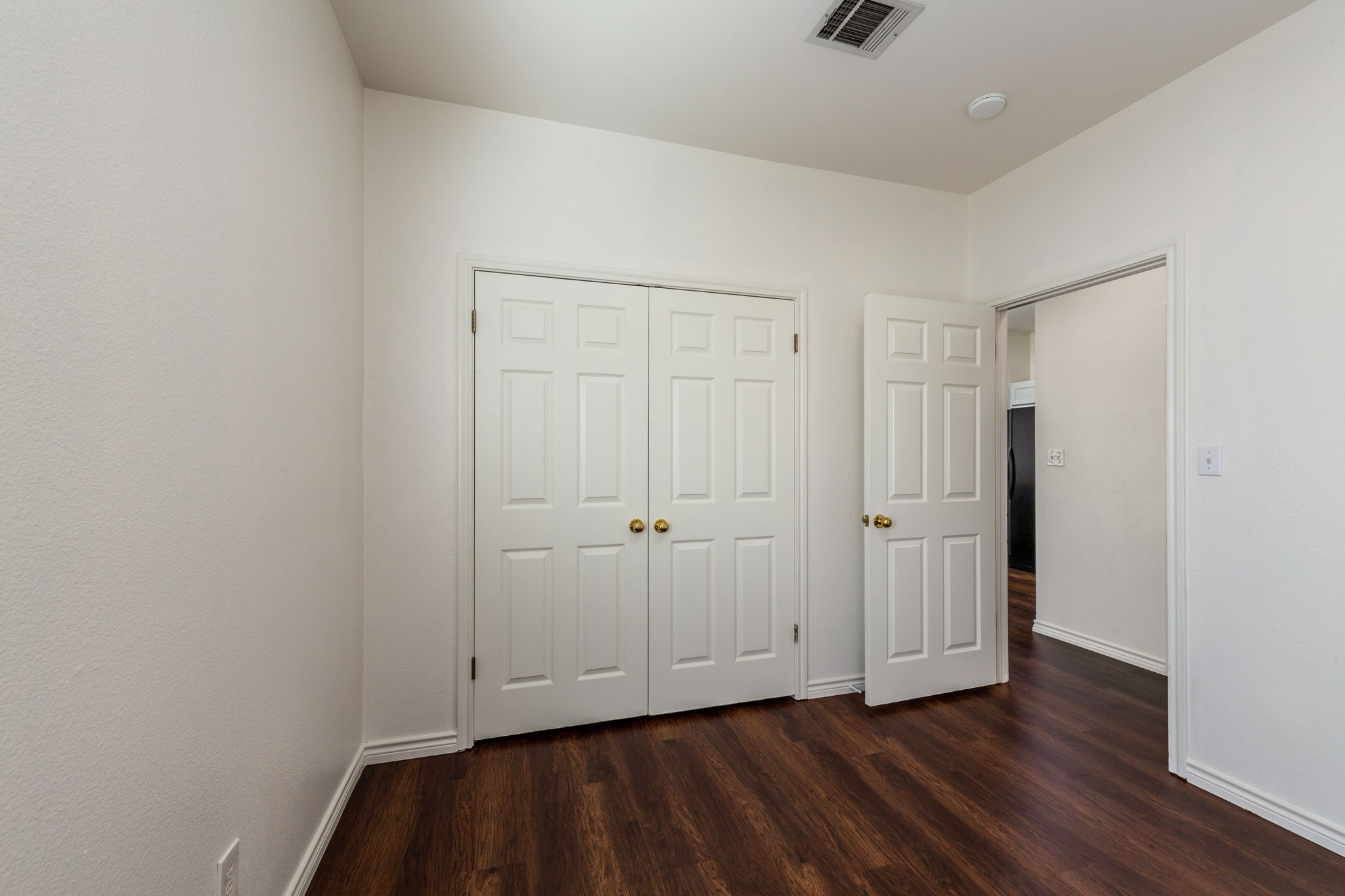 8708 Weiser Drive, Unit B Austin, TX 78729 - Photo 21 of 30 a view of an empty room and wooden floor