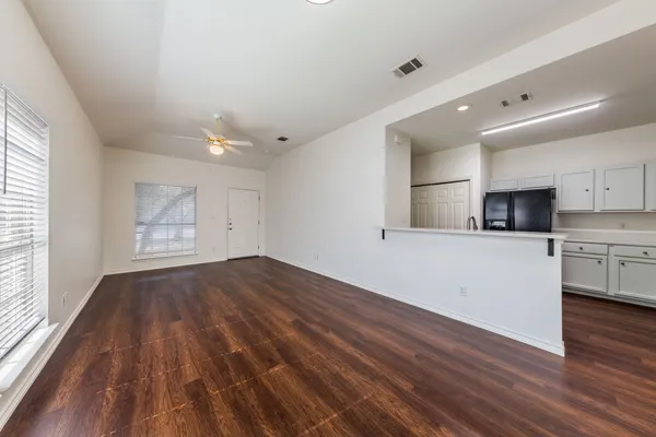 a view of cabinets and wooden floor