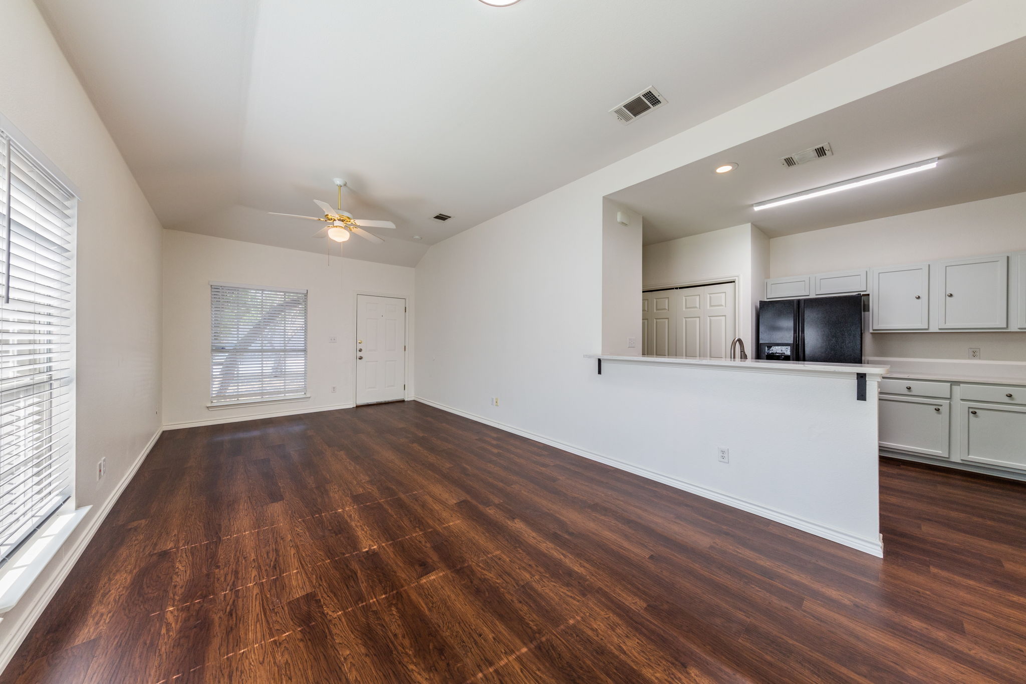 8708 Weiser Drive, Unit B Austin, TX 78729 - Photo 3 of 30 a view of cabinets and wooden floor