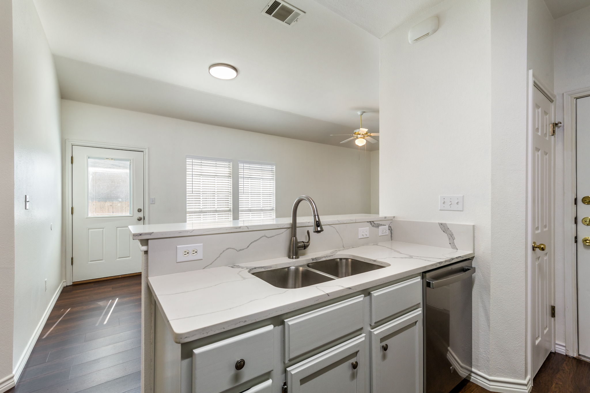 8708 Weiser Drive, Unit B Austin, TX 78729 - Photo 9 of 30 a kitchen with a sink and cabinets