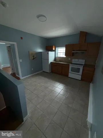 a bathroom with a toilet a sink and shower