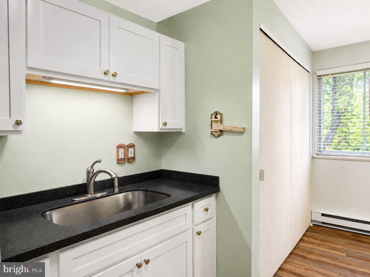 1724 Mosser Road, Unit 11 McHenry, MD 21541 - Photo 6 of 24 a kitchen with a sink and cabinets
