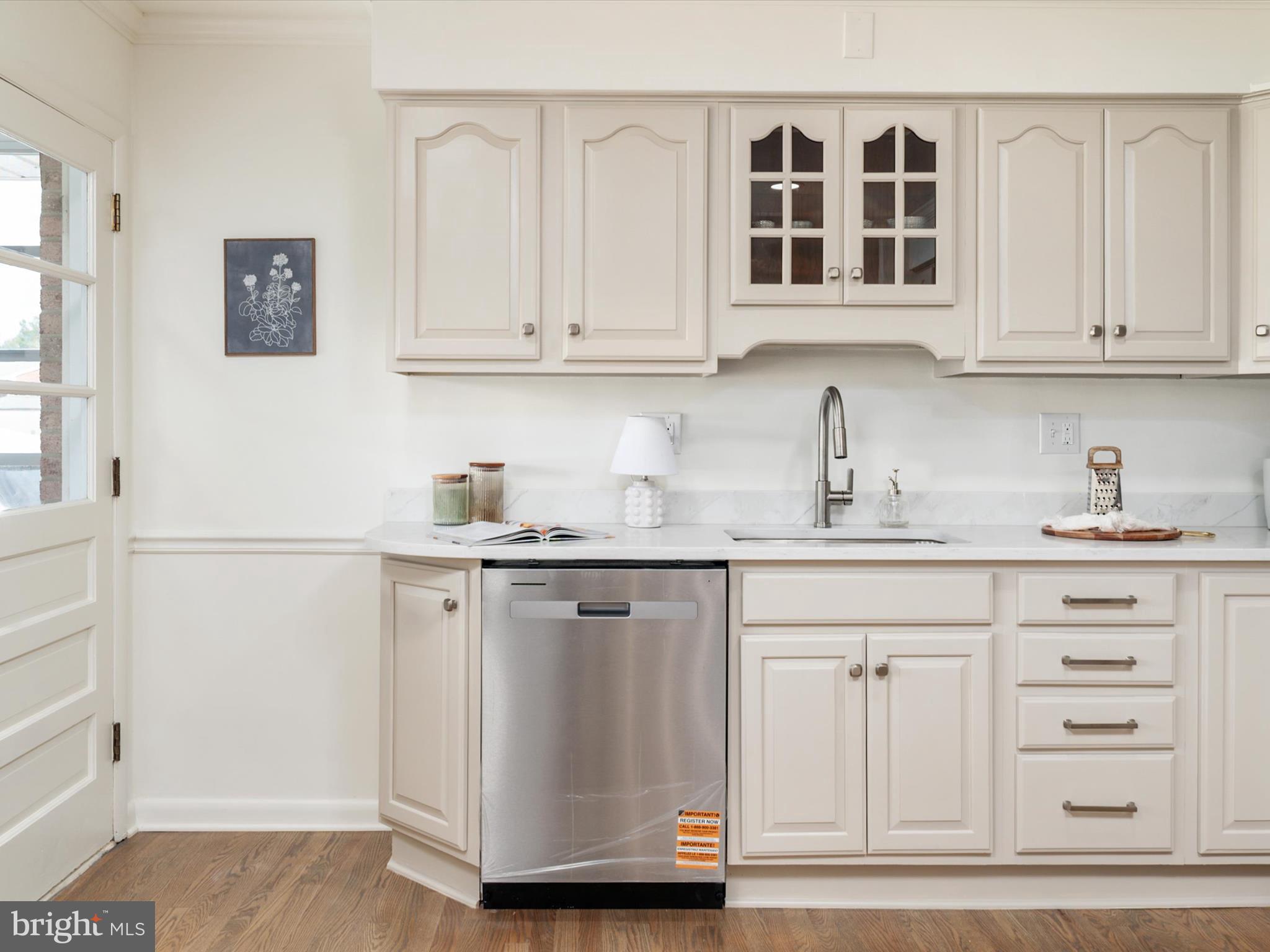9212 Gardenia Road Baltimore, MD 21236 - Photo 16 of 44 a kitchen with white cabinets and sink