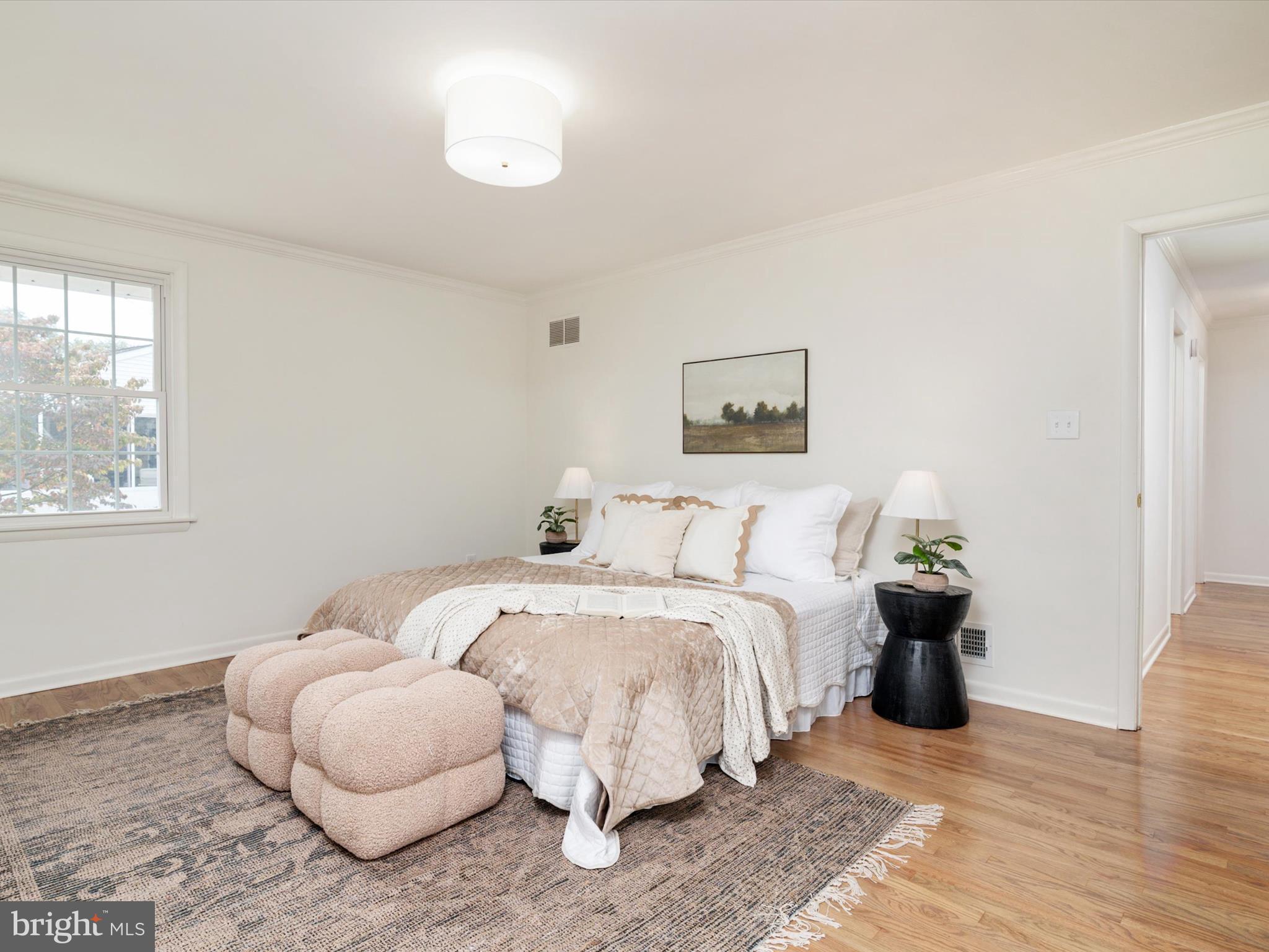 9212 Gardenia Road Baltimore, MD 21236 - Photo 17 of 44 a bedroom with bed and a window