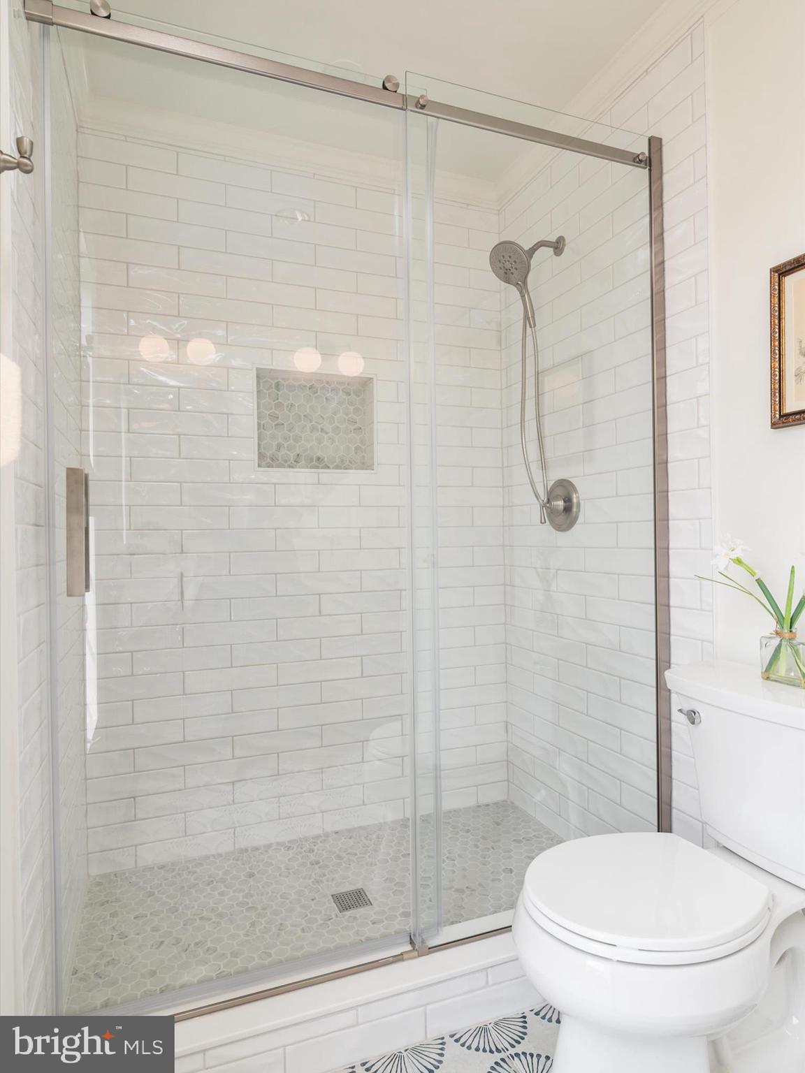 9212 Gardenia Road Baltimore, MD 21236 - Photo 20 of 44 a white toilet next to a bathroom