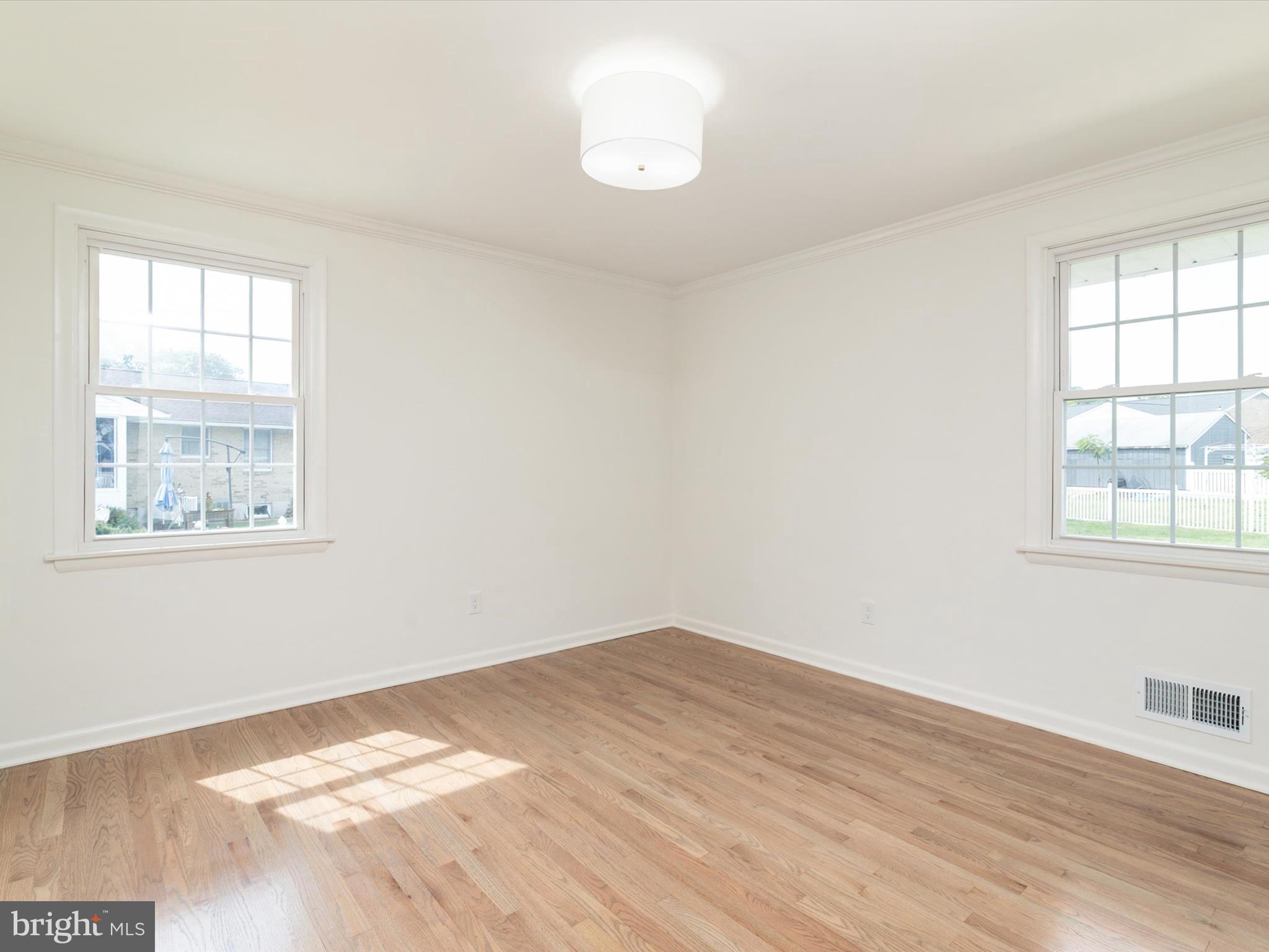 9212 Gardenia Road Baltimore, MD 21236 - Photo 21 of 44 a view of a room with wooden floor and window