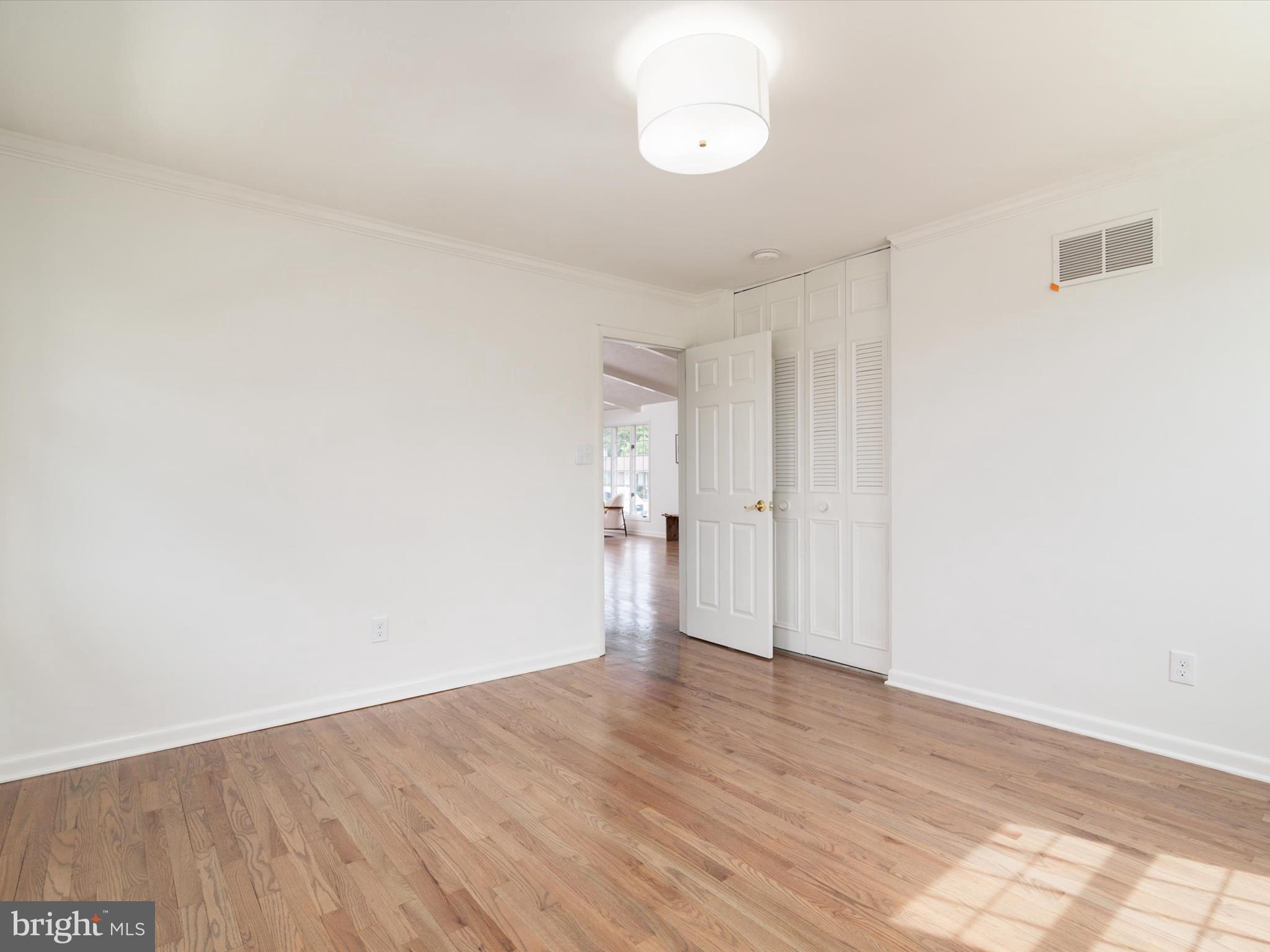 9212 Gardenia Road Baltimore, MD 21236 - Photo 22 of 44 a view of empty room with wooden floor