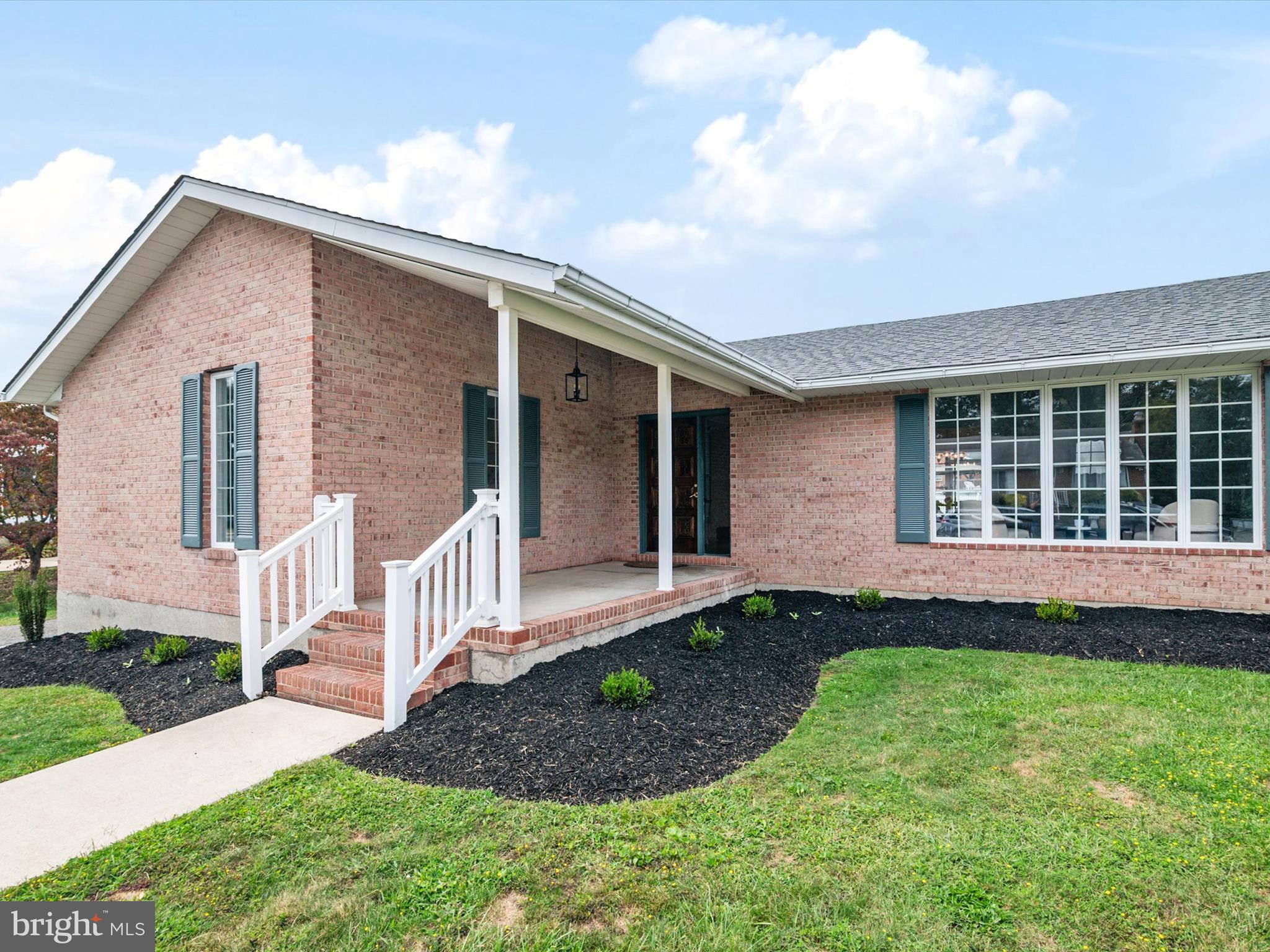 9212 Gardenia Road Baltimore, MD 21236 - Photo 5 of 44 a front view of a house with a yard