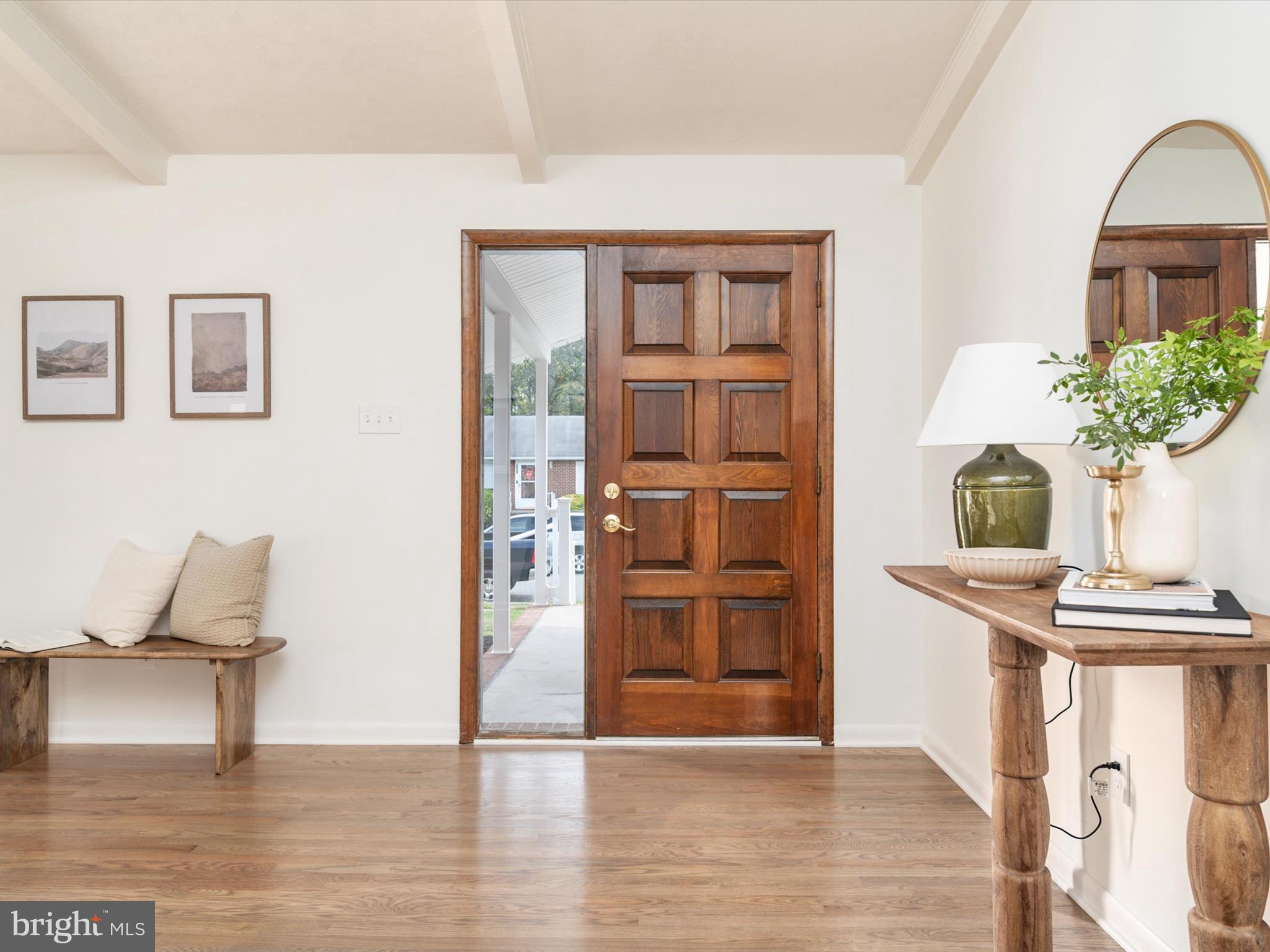 9212 Gardenia Road Baltimore, MD 21236 - Photo 6 of 44 a view of empty room with wooden floor and fireplace