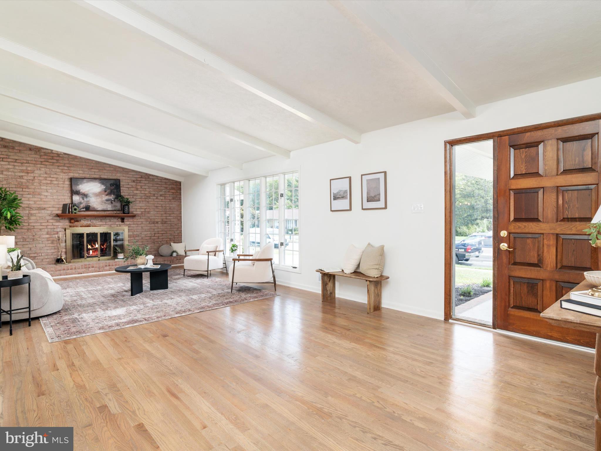 9212 Gardenia Road Baltimore, MD 21236 - Photo 7 of 44 a living room with furniture and a wooden floor