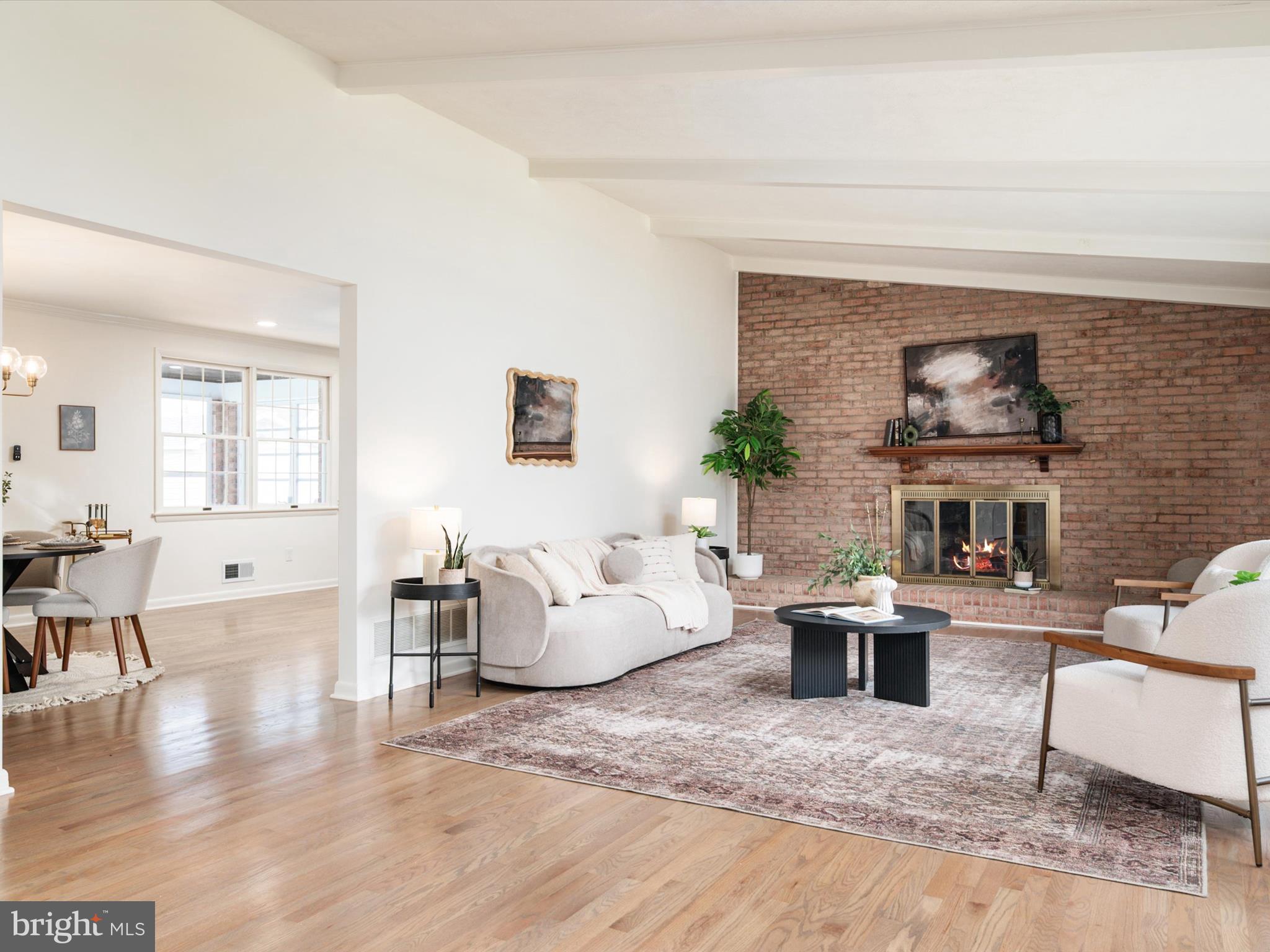 9212 Gardenia Road Baltimore, MD 21236 - Photo 8 of 44 a living room with furniture and a fireplace