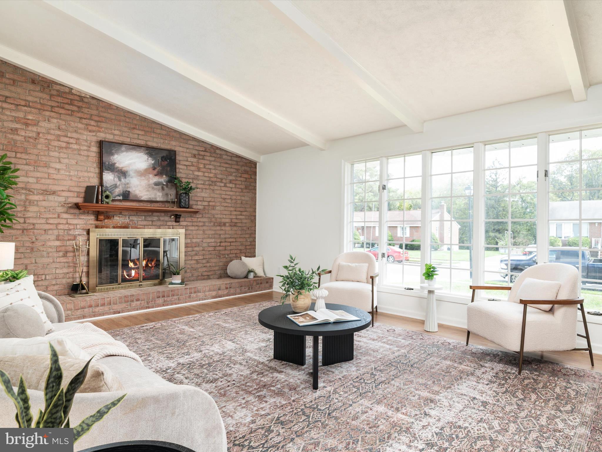9212 Gardenia Road Baltimore, MD 21236 - Photo 9 of 44 a living room with furniture a fireplace and a large window