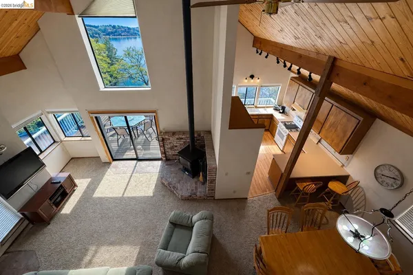 a view of living room with furniture and a window