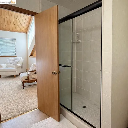 a bedroom with a walk in closet and a window