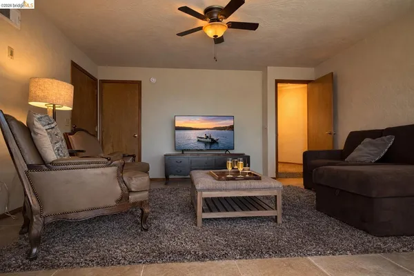 a living room with furniture and a window