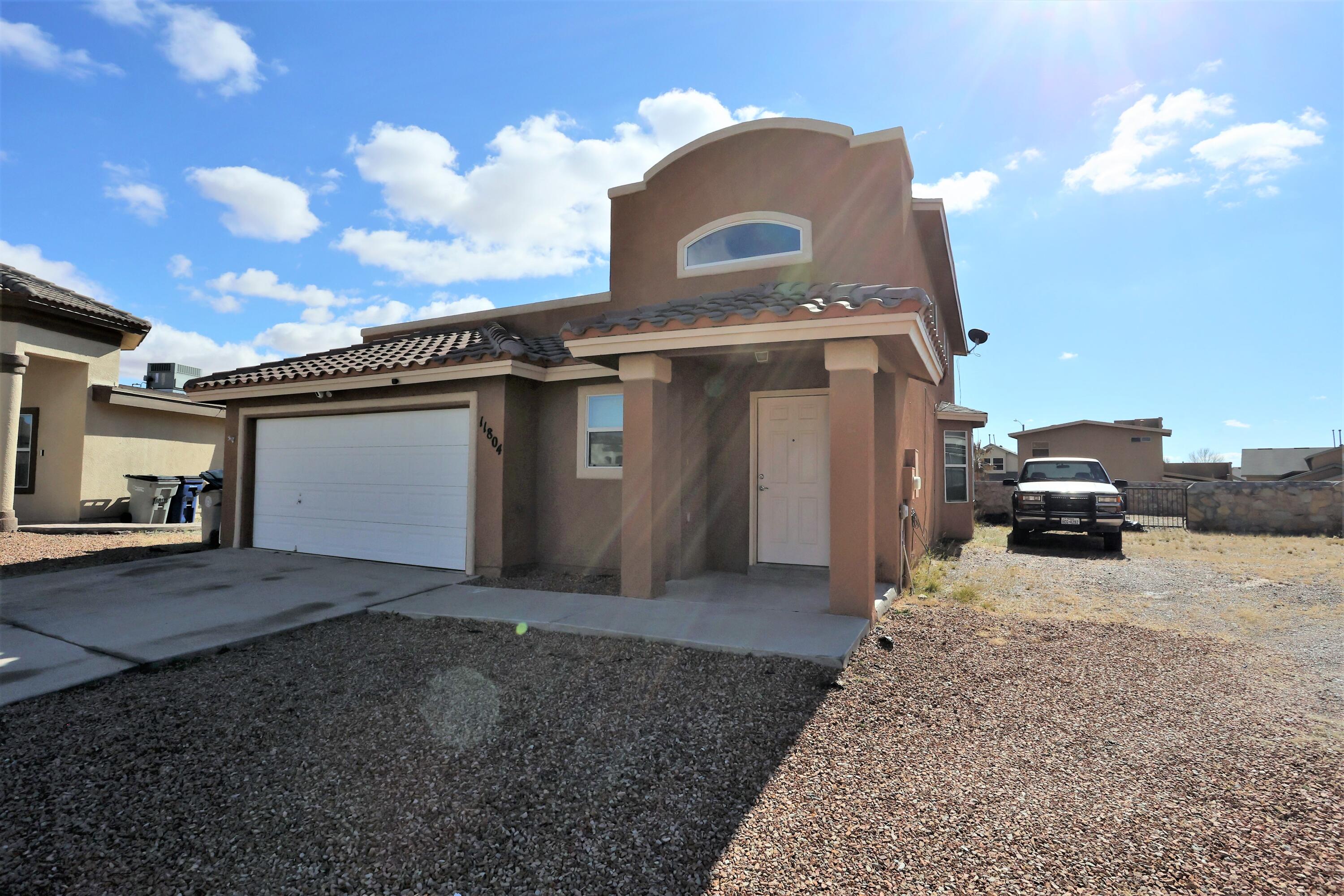 11804 Daplin Way El Paso, TX 79934 - Photo 1 of 1 a view of a car garage