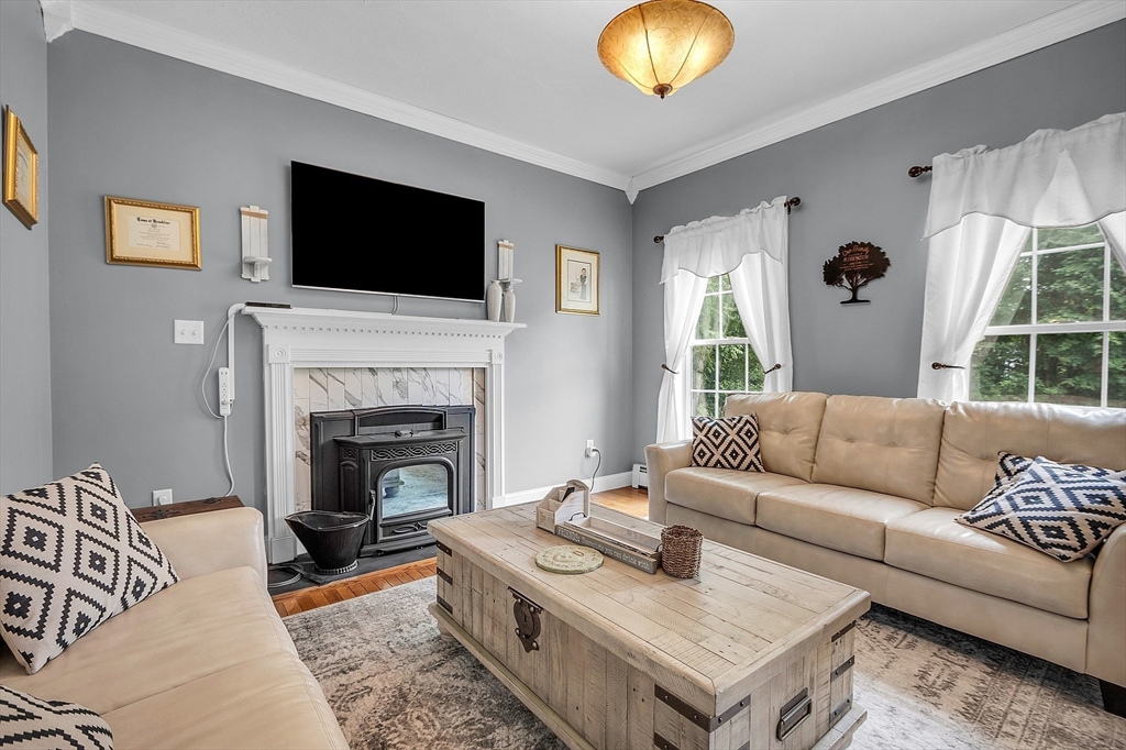 22 French Road Templeton, MA 01468 - Photo 13 of 42 a living room with furniture a flat screen tv and a fireplace