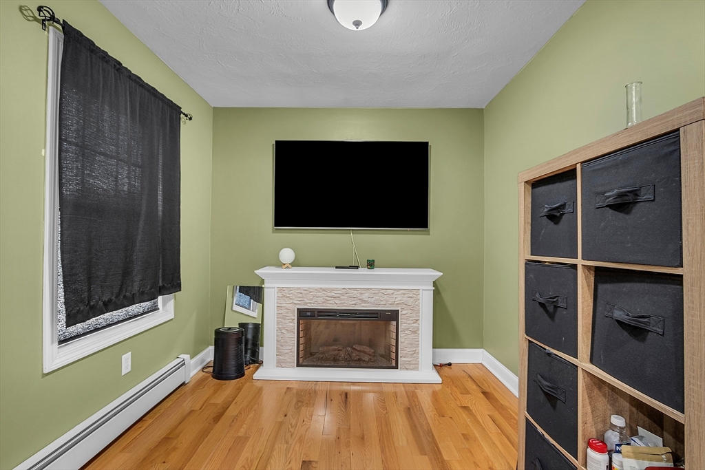 22 French Road Templeton, MA 01468 - Photo 20 of 42 a living room with a flat screen tv and a fireplace