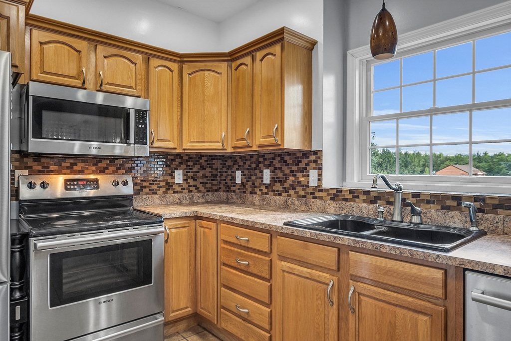 22 French Road Templeton, MA 01468 - Photo 7 of 42 a kitchen with stainless steel appliances a stove sink and microwave
