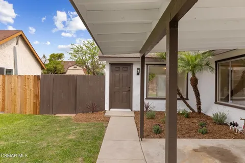 a house view with a backyard space