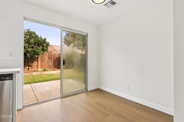 a view of a room that has a large window