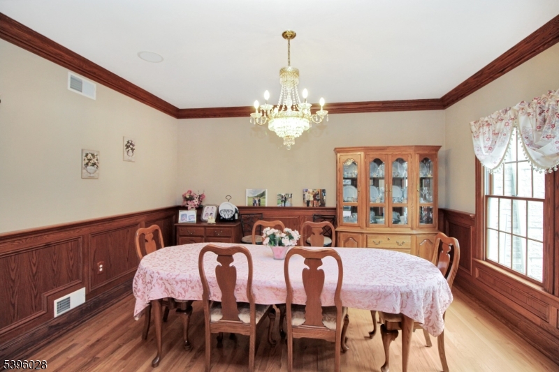87 Walnut Valley Road Blairstown, NJ 07832 - Photo 13 of 33 a view of a dining room with furniture a chandelier and wooden floor