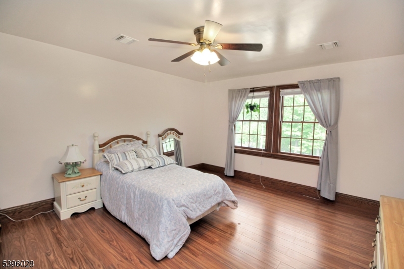 87 Walnut Valley Road Blairstown, NJ 07832 - Photo 21 of 33 a spacious bedroom with a bed and a large window