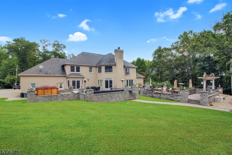 87 Walnut Valley Road Blairstown, NJ 07832 - Photo 32 of 33 a front view of a house with patio and garden
