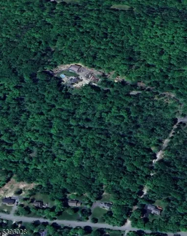 a view of a house in a forest