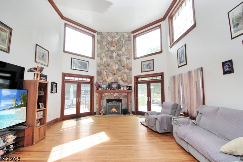 87 Walnut Valley Road Blairstown, NJ 07832 - Photo 5 of 33 a living room with fireplace furniture and a flat screen tv
