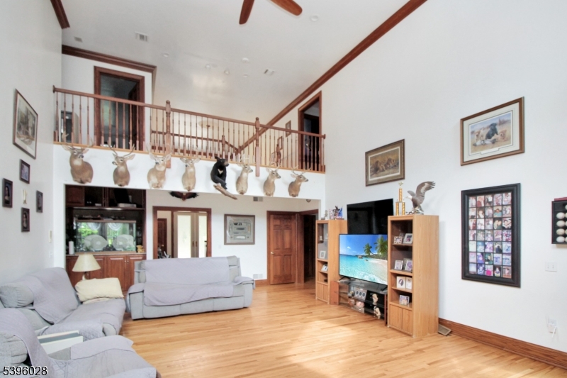 87 Walnut Valley Road Blairstown, NJ 07832 - Photo 6 of 33 a living room with furniture and a flat screen tv