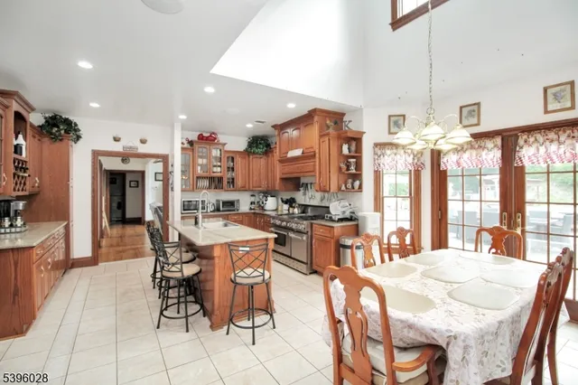 a large kitchen with a table and chairs
