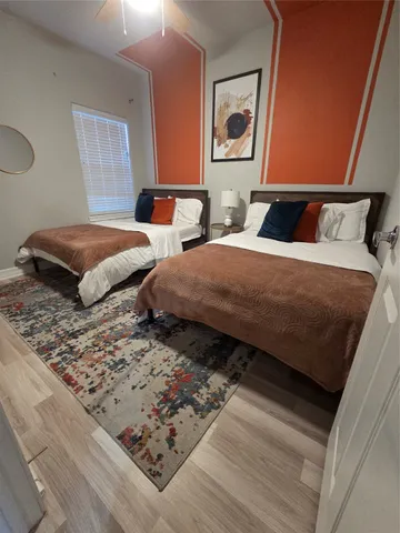 a bedroom with bed and window