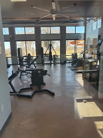 a lobby with furniture and floor to ceiling window