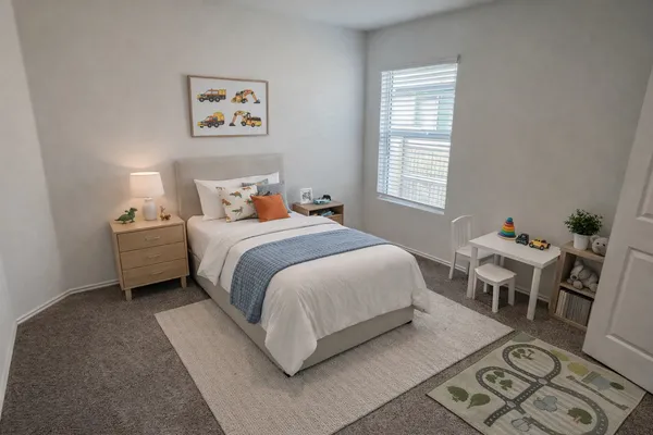 a bedroom with a bed and a table in it