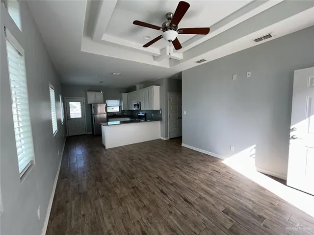 a view of a electric appliances in kitchen and a window