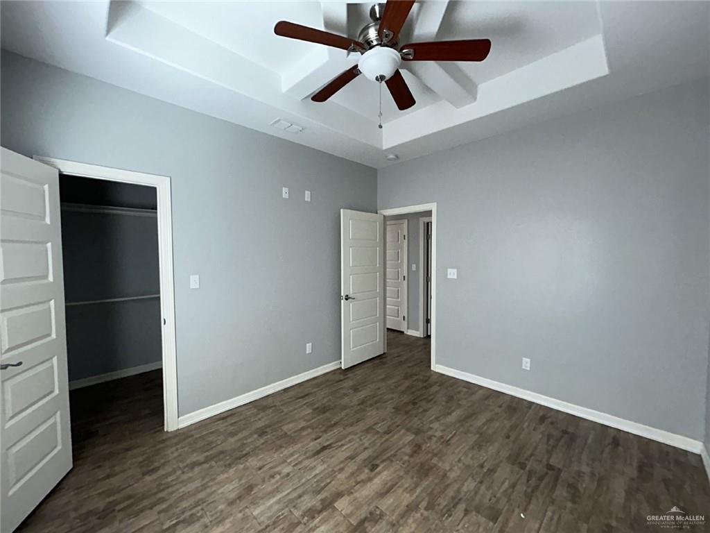 2100 Jackson Street, Unit 1 Weslaco, TX 78599 - Photo 8 of 13 an empty room with closet and a ceiling fan