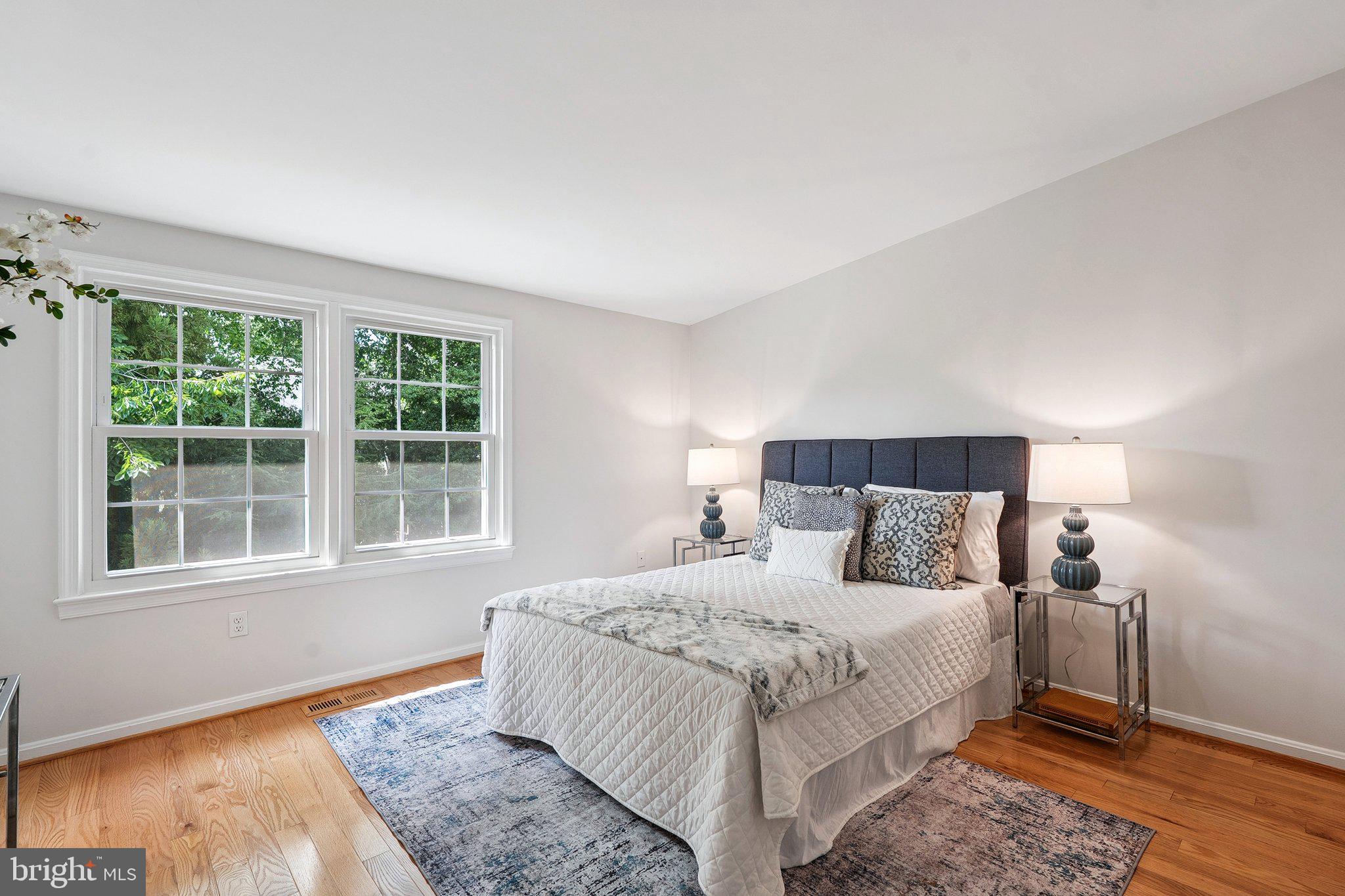 6861 Washington Boulevard Arlington, VA 22213 - Photo 17 of 28 a bedroom with a bed and a window