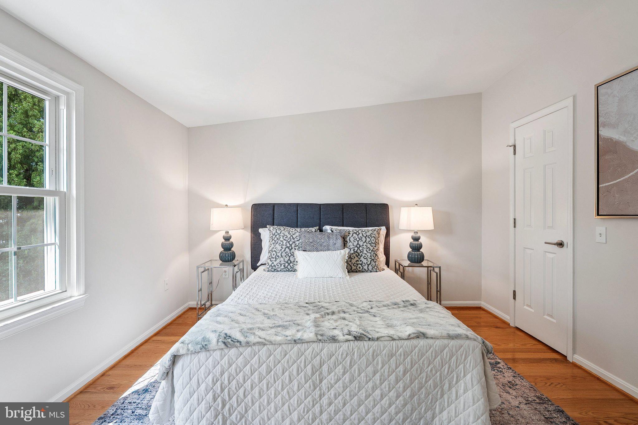 6861 Washington Boulevard Arlington, VA 22213 - Photo 21 of 28 a bedroom with a bed and a window