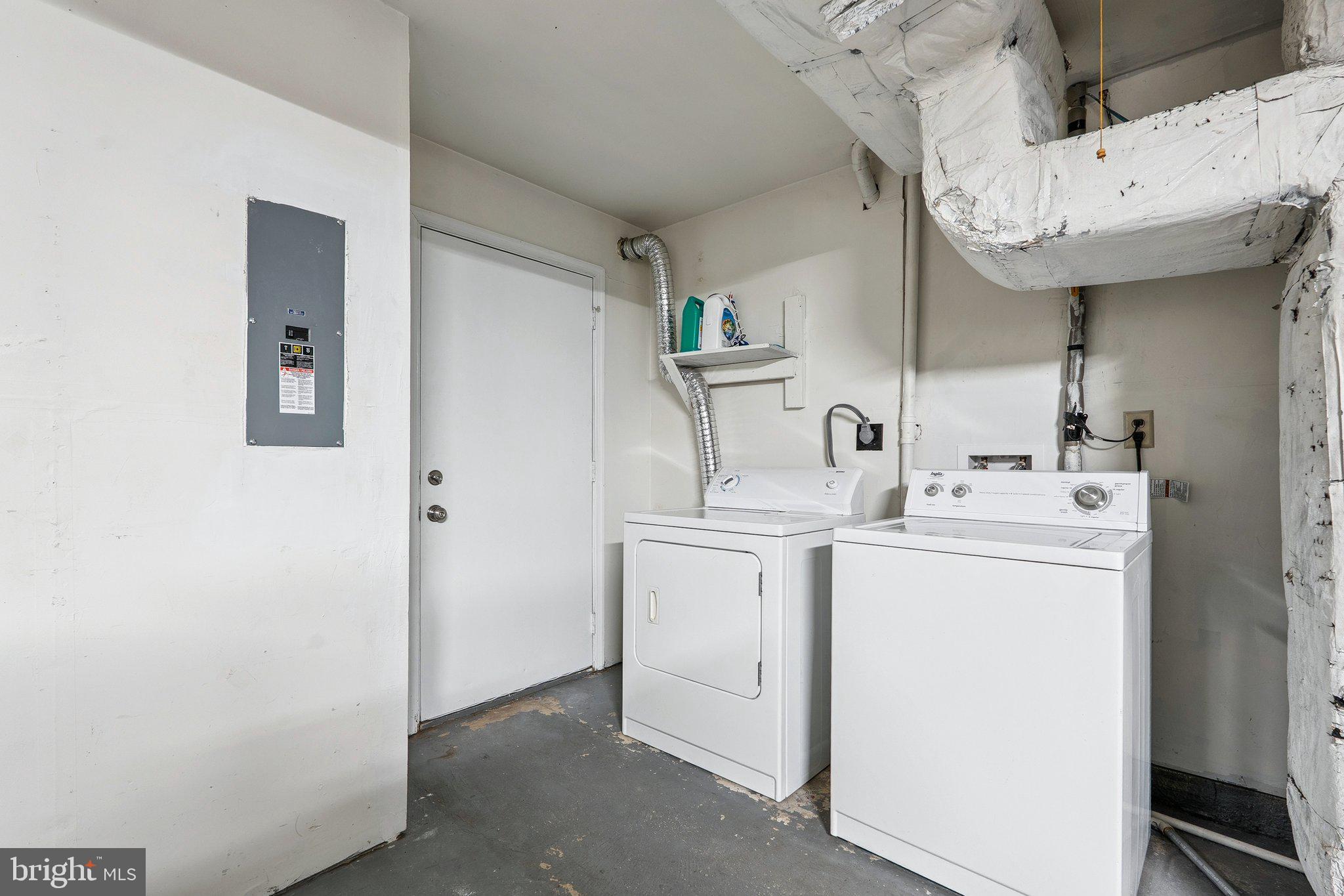 6861 Washington Boulevard Arlington, VA 22213 - Photo 22 of 28 a utility room with dryer and washer