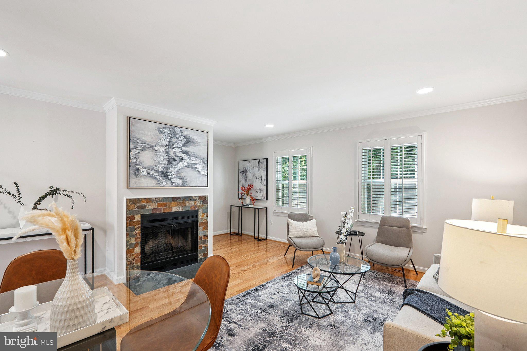 6861 Washington Boulevard Arlington, VA 22213 - Photo 10 of 28 a living room with furniture and a fireplace