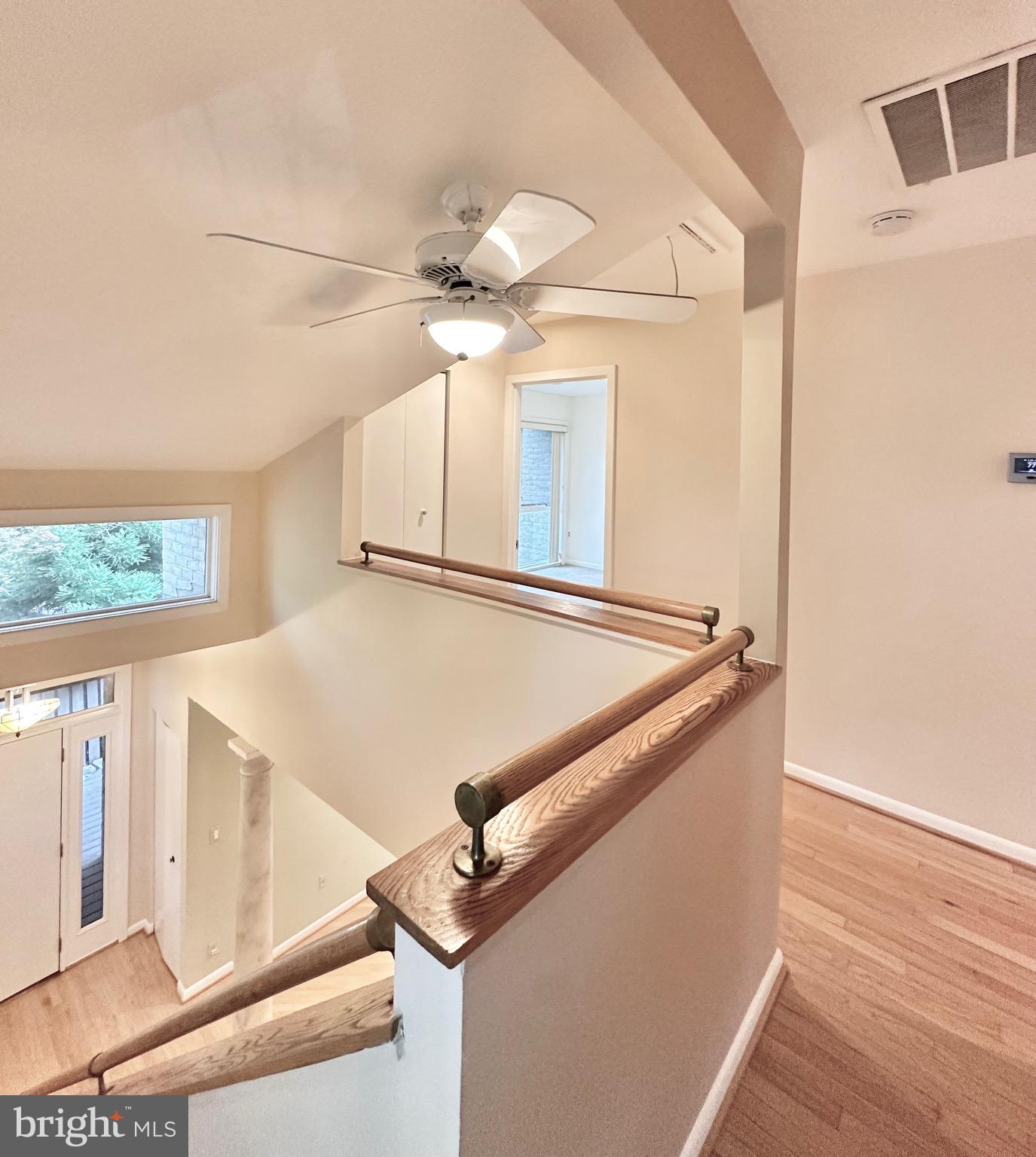 2021 Lakebreeze Way Reston, VA 20191 - Photo 22 of 51 a kitchen with a refrigerator a ceiling fan and a stove top oven
