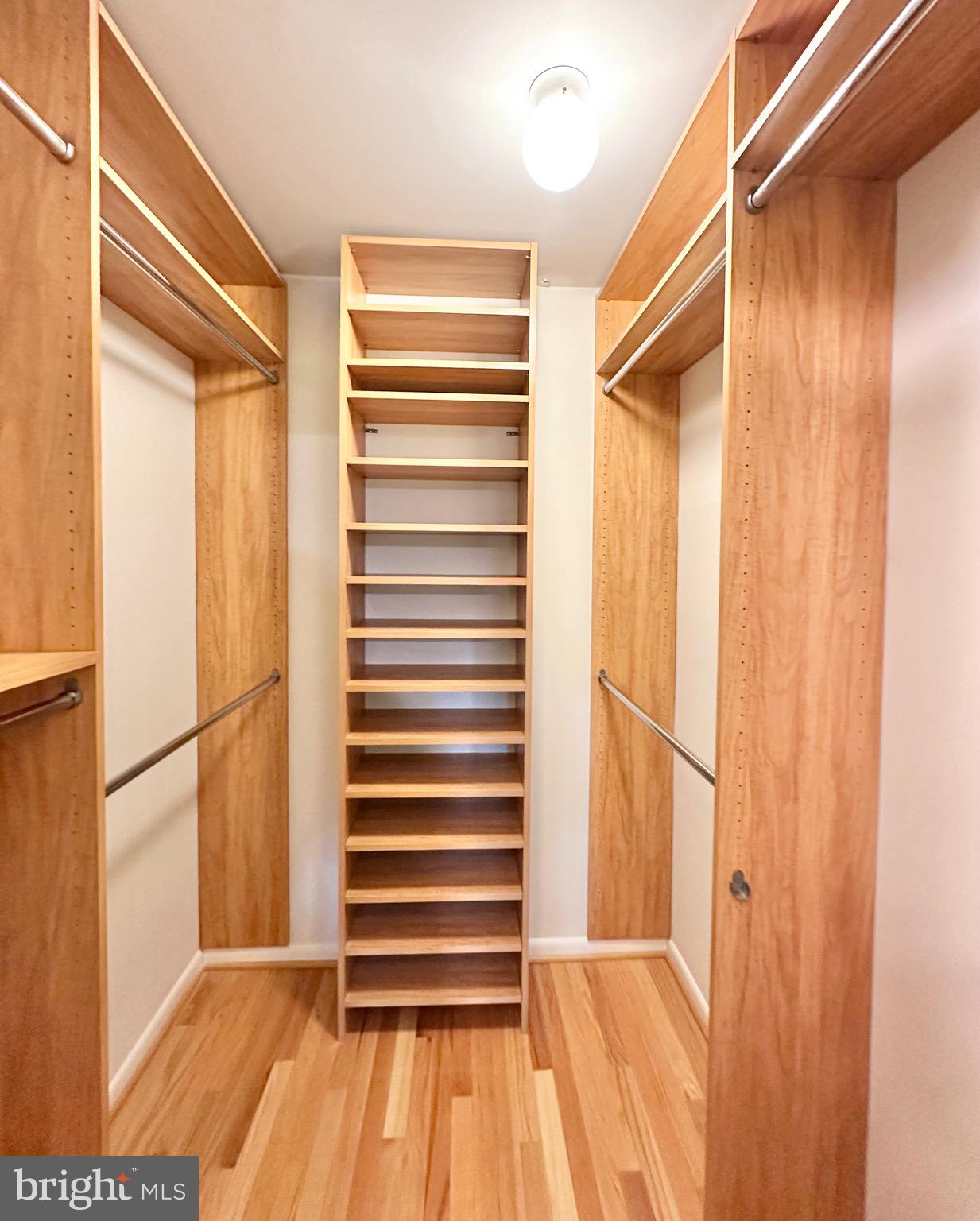 2021 Lakebreeze Way Reston, VA 20191 - Photo 28 of 51 a view of closet with wooden floor and a window